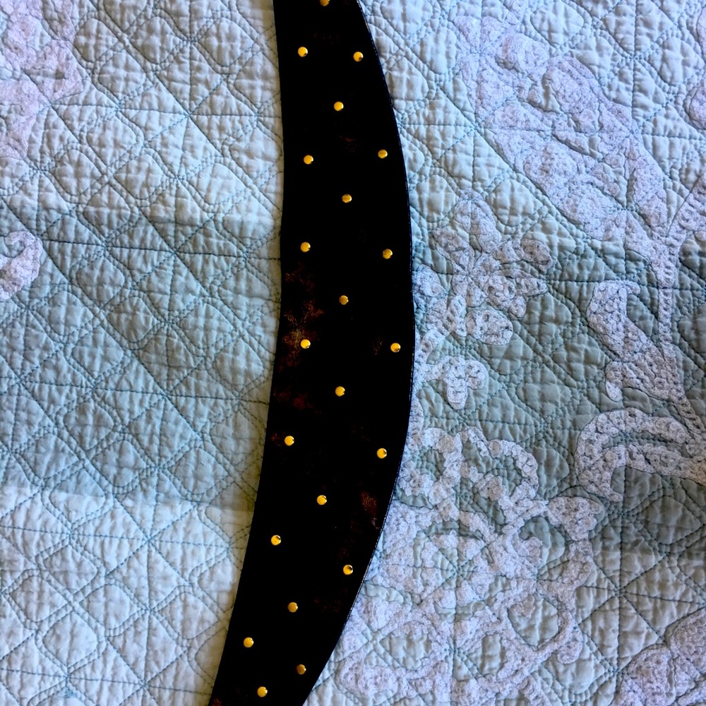 Metallic belt with studs.